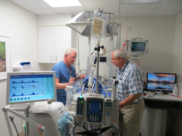 Drs. Greg Glasscock and Carl Yaeger at the beside in the Salinas NICU.
